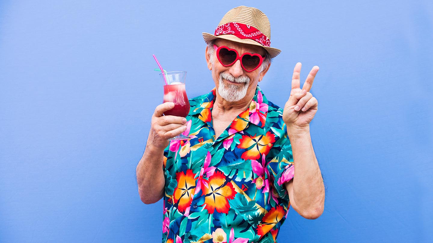 Man in Hawaiian shirt with cocktail