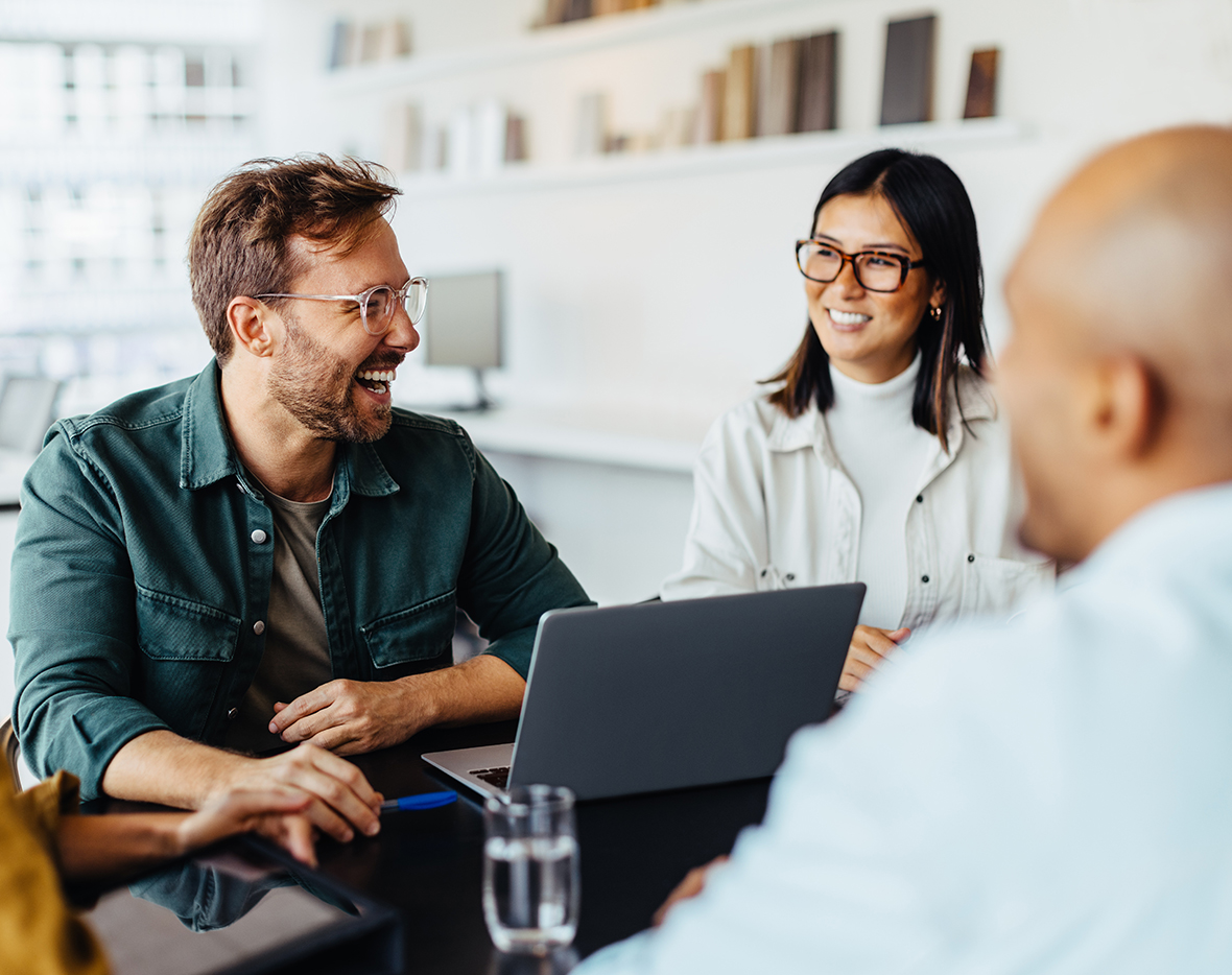 Group laughing during meeting