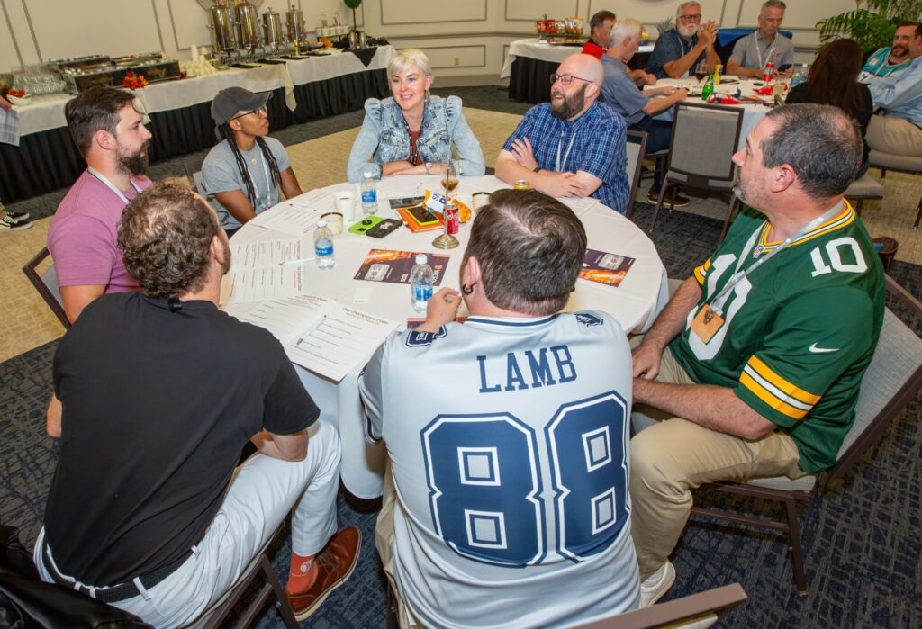 Virginia CEOs gathered around a table in a peer advisory roundtable discussion